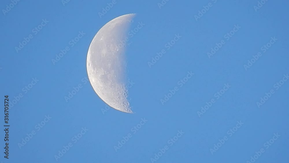 Daybreak Crescent moon close up on craters on moons surface. Daybreak Crescent moon close up on craters on moons surface.