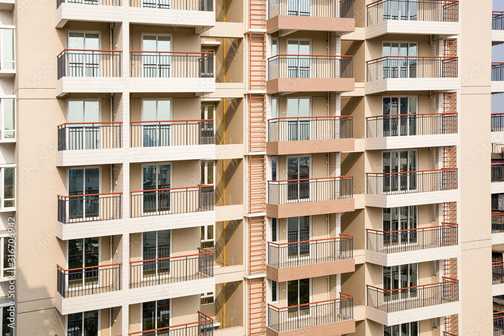 Close up shot for a new residential building with Geometric patterned balconies Close up shot for a new residential building with Geometric patterned balconies