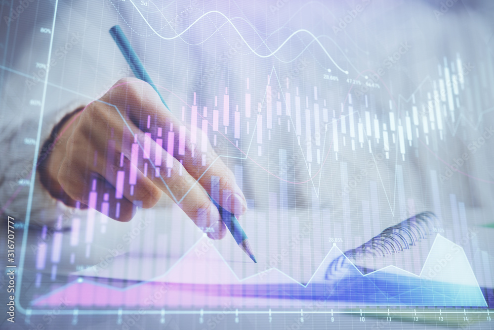 Financial forex graph displayed on hands taking notes background. Concept of research. Double exposure Financial forex graph displayed on hands taking notes background. Concept of research. Double exposure