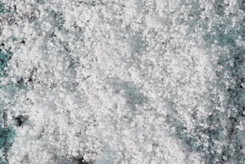 Grainy texture snow, natural background, close up detail top view