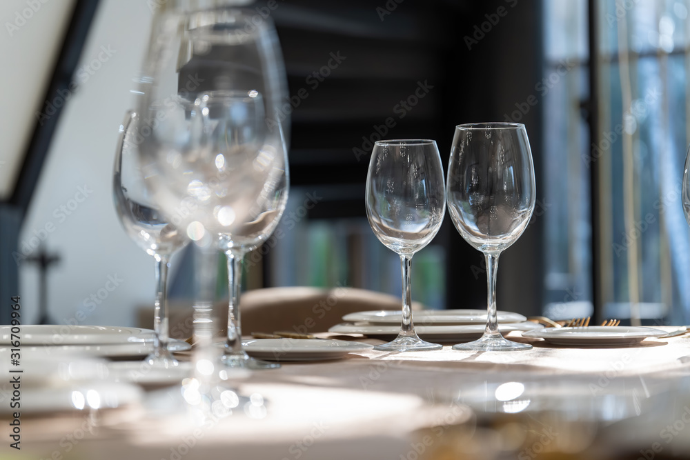Beautiful table setting with glasses, plates and napkins. General form-2.