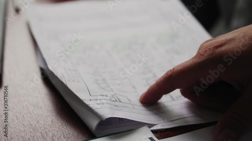 worker learns drawing of gas and oil refinery equipment photo