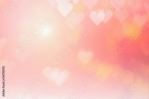 Blurred background of Valentine's day concept. Pink Valentines Day Card. Pastel color tone soft have gradient pattern. Multicolor white pink, orange and red hearts blur wallpaper in love bright sexy..