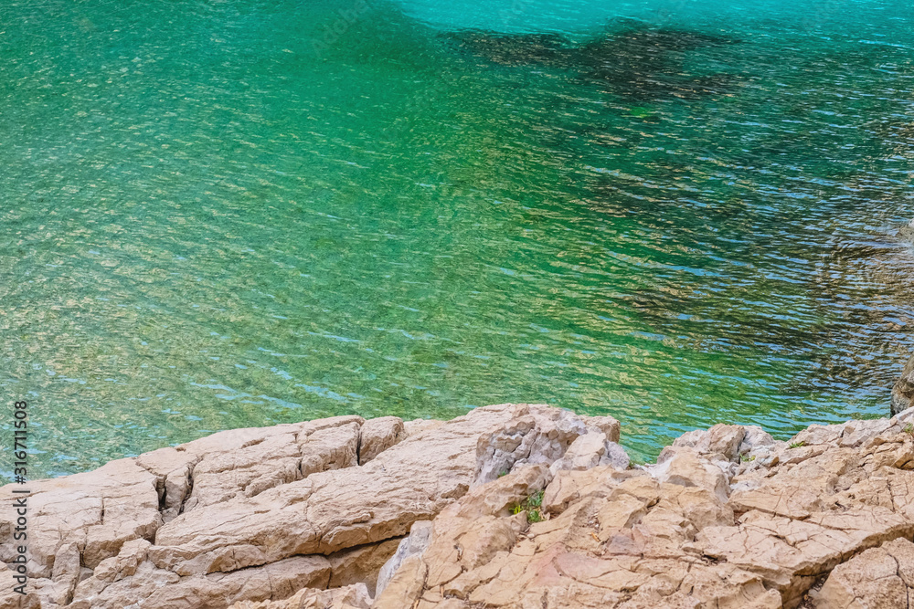 Beautiful beach with turquoise water and rocky cliffs in Calanques National Park, Cassis. Beautiful beach with turquoise water and rocky cliffs in Calanques National Park, Cassis.