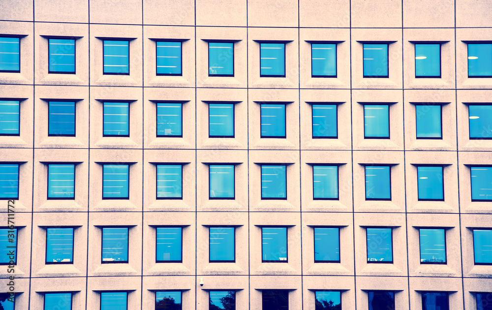 Beautiful texture with blue windows on the facade of a modern home