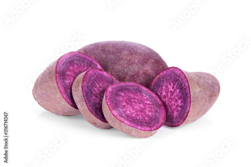 raw purple sweet potato or yam isolated on white background