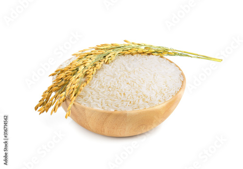 white rice (Thai Jasmine rice) in the wooden bowl and unmilled rice isolated on white background