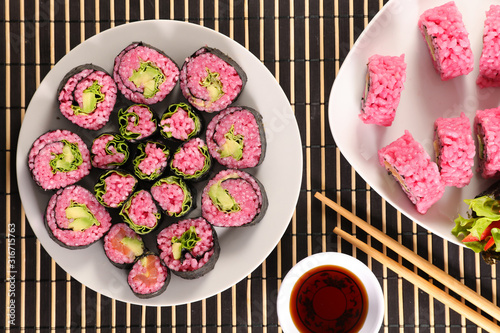 vegetarian maki roll with soy sauce- maki cooked with beetroot and avocado