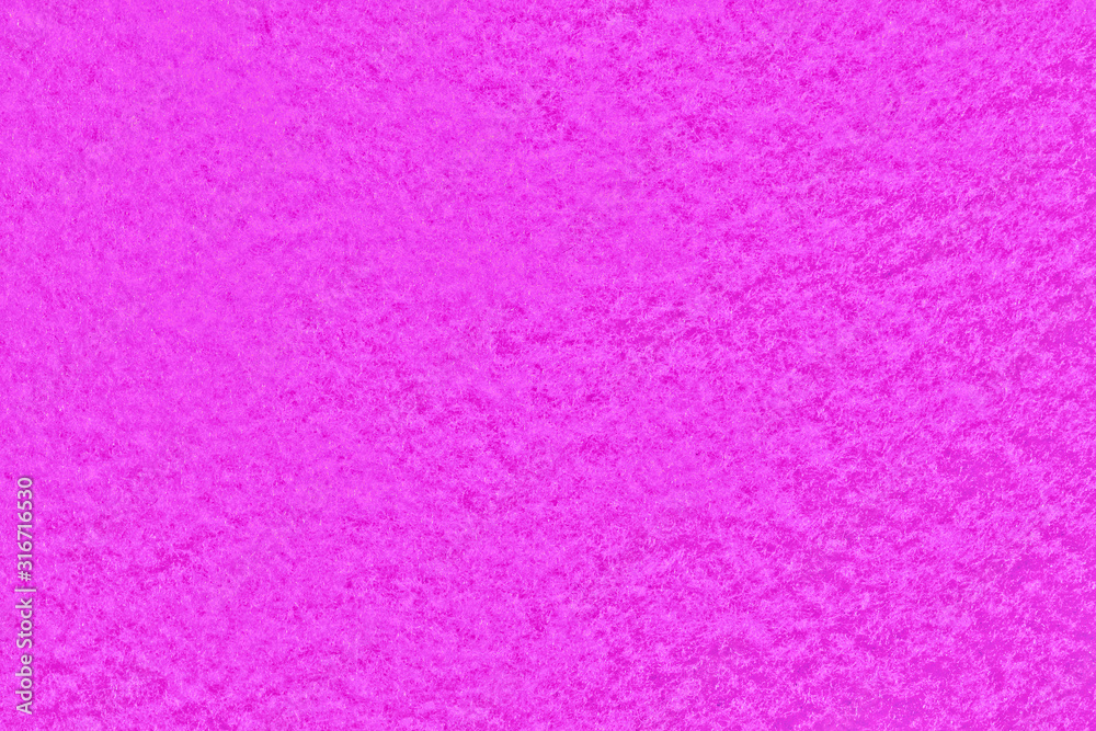 Texture of pink foam material. Background felt of fabric with uniform pattern