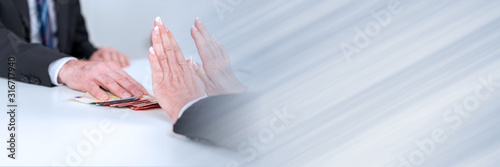 Photography Woman hands rejecting an offer of money; panoramic banner