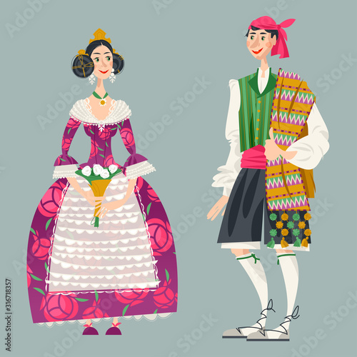 Couple in traditional clothes during the festival of Las Fallas (Festival of Fire) in Valencia, Spain. photo