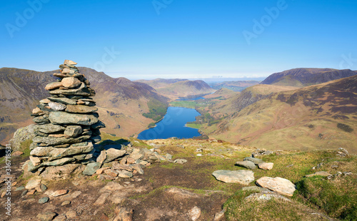 Views of Gatesgarth and lake Buttermere from the summit of Fleetwith Pike on a sunny blue sky day in the Lake District. photo