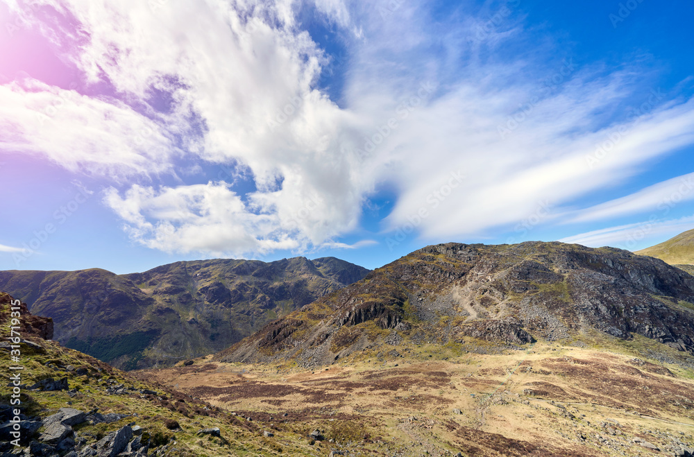 The summits of Pillar on the left and Seat on the right on a sunny blue sky day in the English Lake District.