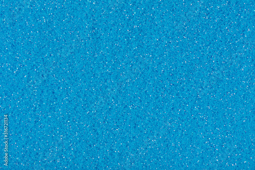 Glitter texture in blue color, background for your Christmas design.