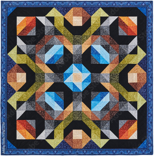 Quilt with geometric pattern consisting of triangles and squares
