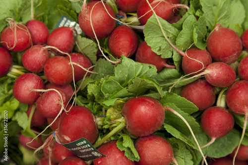 Close-up of raw radish on display in market