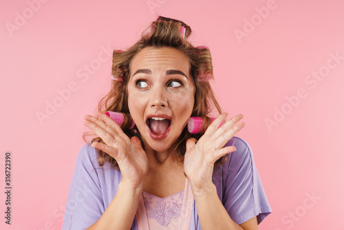 Image of young frightened woman screaming and looking aside