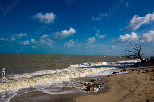 The blurred natural background of the blue sky by the large lake, with the sea rolling over the beach all the time, can be seen during the summer season.