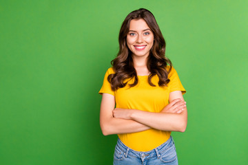 Portrait of her she nice attractive lovely charming pretty cute cheerful cheery content wavy-haired girl folded arms isolated on bright vivid shine vibrant green color background