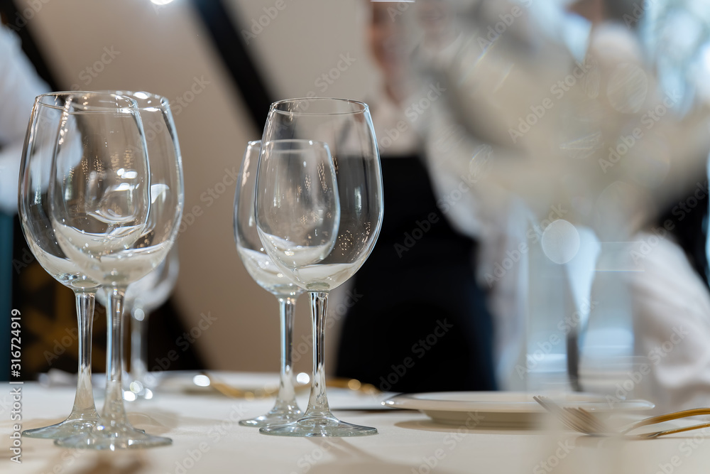 Chic and elegant, gold-plated cutlery and white plates, table setting with empty plates-2. Chic and elegant, gold-plated cutlery and white plates, table setting with empty plates-2.