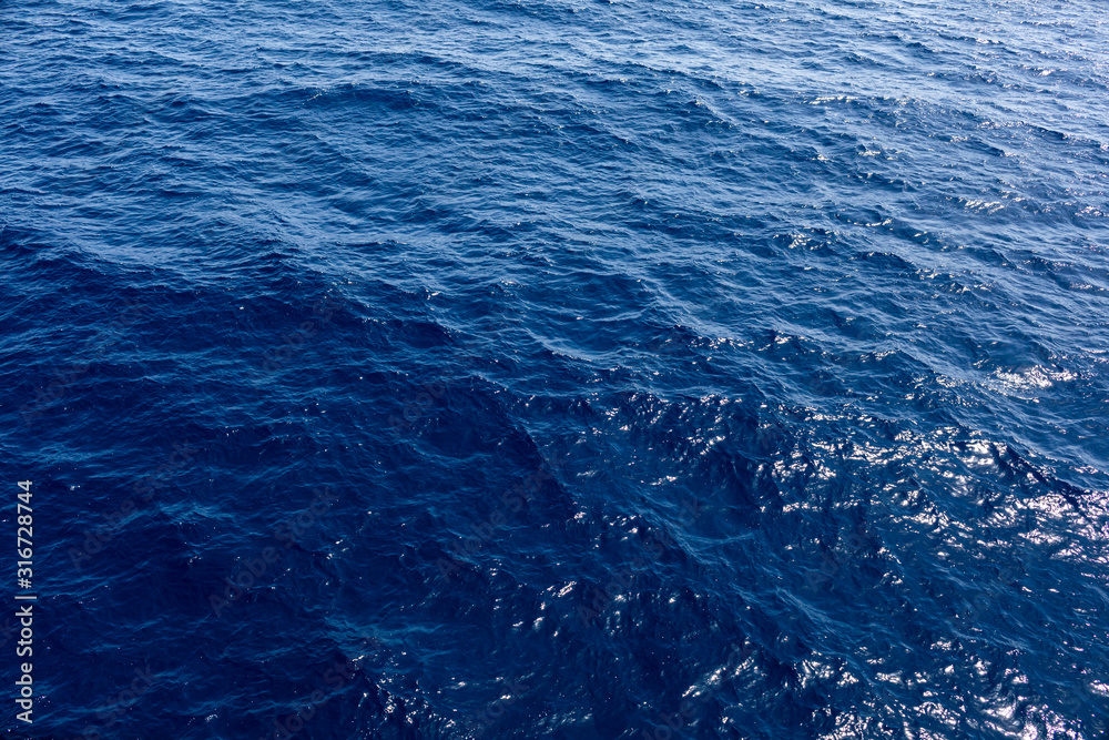 sea or ocean background. Blue sea water in calm.