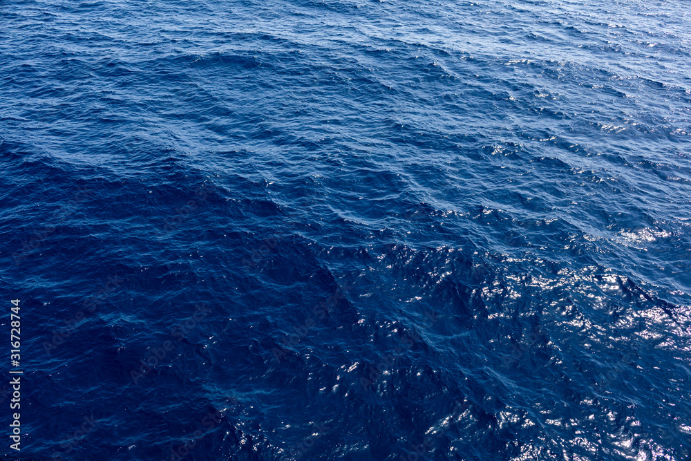 Naklejka premium sea or ocean background. Blue sea water in calm.