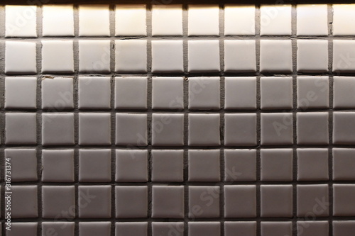 small white mosaic tile decoration on wall background