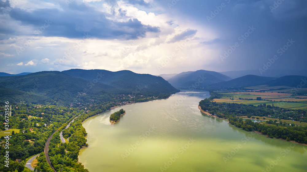 Summer rain and stormy weather. Danube river valley panorama.