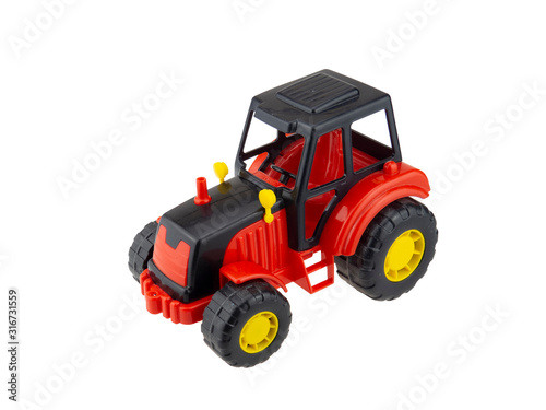Plastic tractor toy. Isolated on white background.