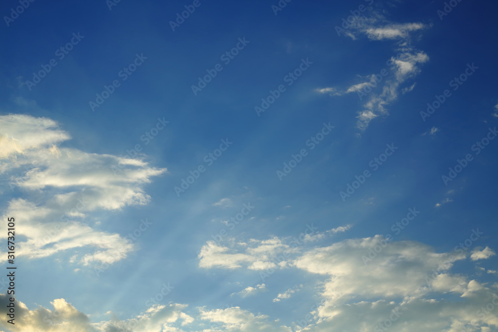 Fototapeta premium sunlight shine through cloud on dramatic blue sky background