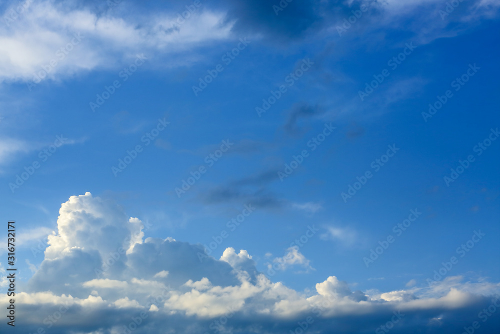 sunlight through fluffy white cloud on clear blue sky background sunlight through fluffy white cloud on clear blue sky background