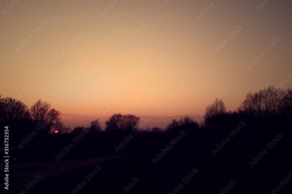winter sunset landscape with red sky and leafless trees winter sunset landscape with red sky and leafless trees