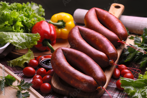 Cracow sausage with vegetables and herbs.