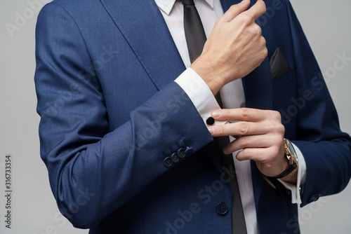 studio shot stylish businessman wearing suit and watches