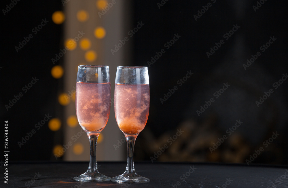 Two glasses of pink champagne for the couple. Two glasses of pink champagne for the couple.