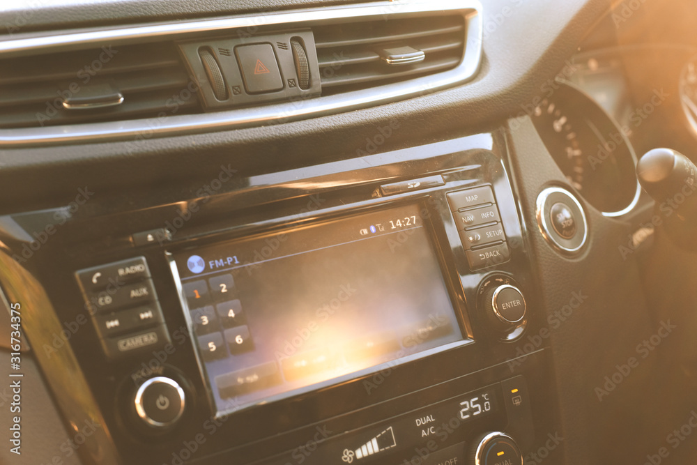 Fototapeta premium Car dashboard interior view of inside the vehicle including steering wheel dials and controls