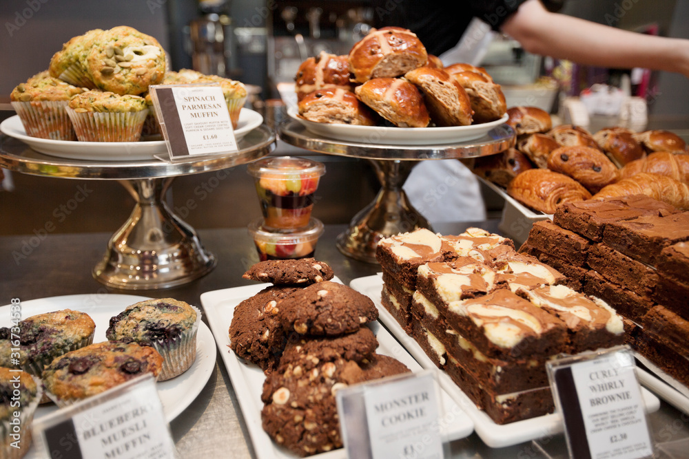 Close-up view of fresh pastries on display in bakery