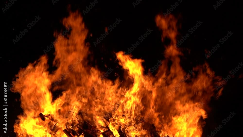 Fire flames on black background, bonfire in the night. Fire flames on black background, bonfire in the night.