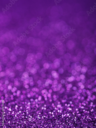 Purple glitter lights background. defocused