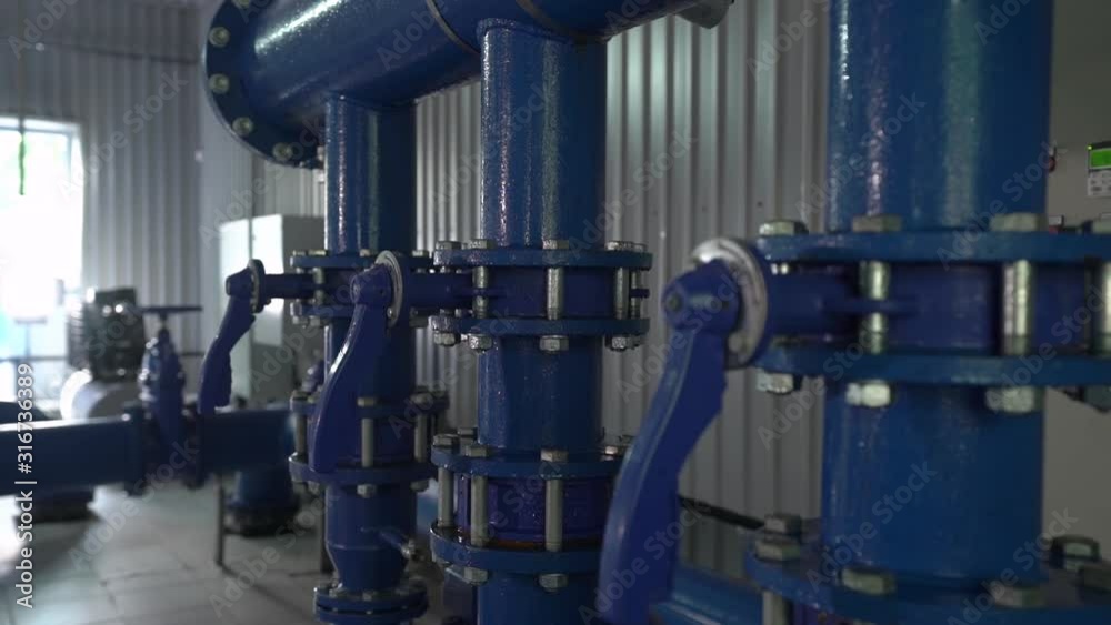 Water valves pipes system condensate equipment at the station of water supply and treatment smooth camera movement
