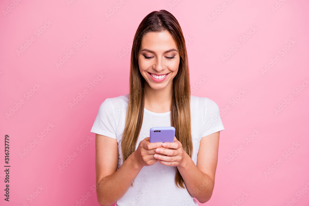 Which picture is best. Photo of pretty lady holding telephone hands texting friends sending new just made selfies wear casual white t-shirt isolated pink color background Which picture is best. Photo of pretty lady holding telephone hands texting friends sending new just made selfies wear casual white t-shirt isolated pink color background
