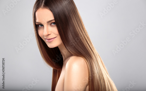 Young woman with beautiful healthy long hair and natural make up. Fashion beauty portrait