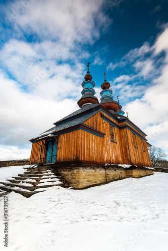 Komancza Wooden Orthodox Church. Carpathian Mountains and Bieszczady Architecture in Winter photo