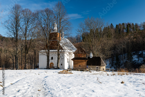 Fototapeta Naklejka Na Ścianę i Meble -  Exterior of Lopienka Orthodox Church.  Bieszczady Architecture in Winter. Carpathia Region in Poland