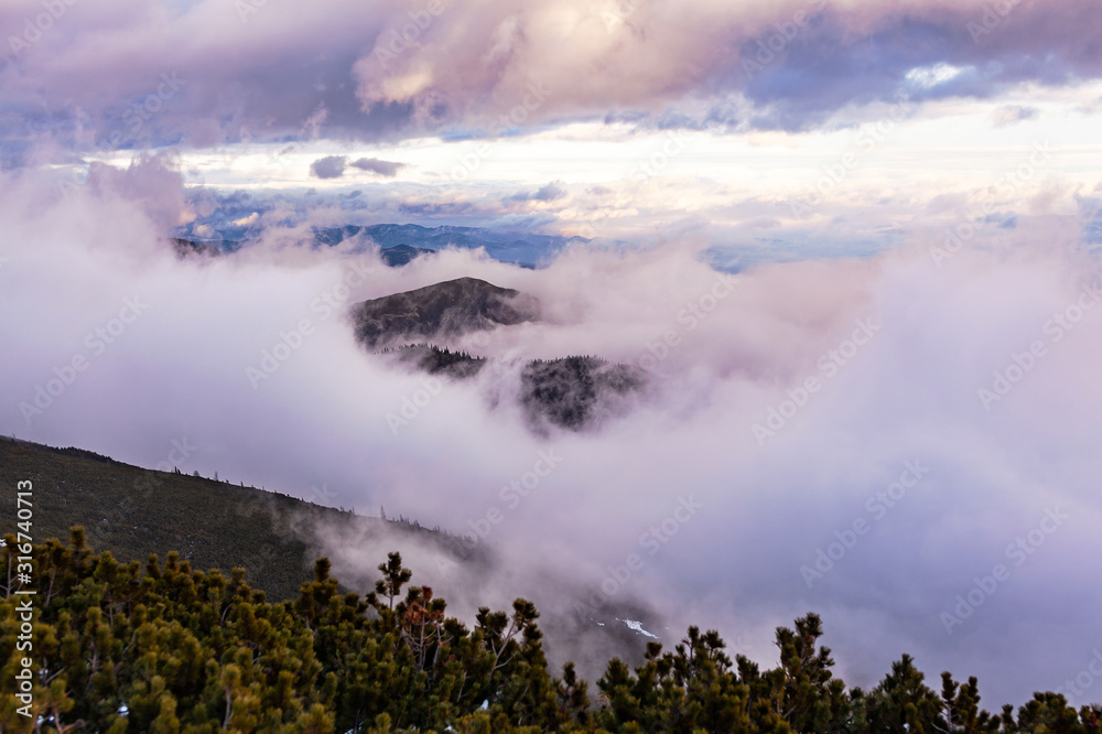 View of the High Tatras with fog and snow