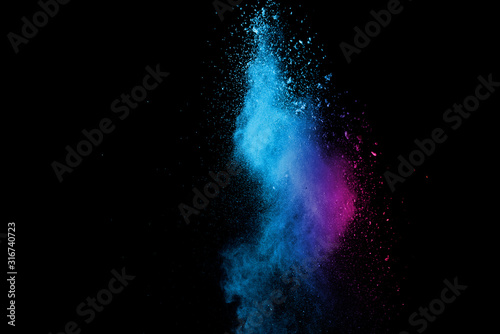 Explosion of colored powder isolated on black background. Abstract colored background. holi festival.