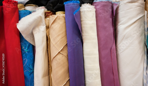 Foto Close-up of rolled fabric cloth bolts