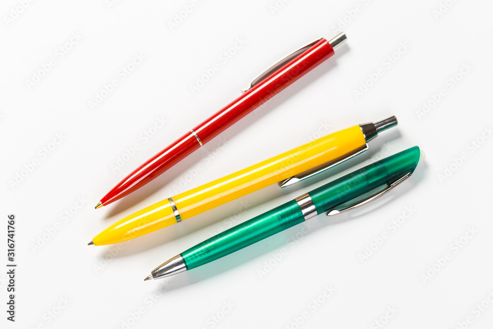 Collection of multi-colored ballpoint pens isolated on a white background Collection of multi-colored ballpoint pens isolated on a white background
