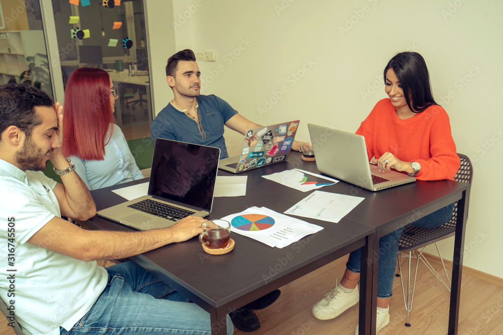 Fototapeta premium Multiethnic startup business team on meeting in modern office interior