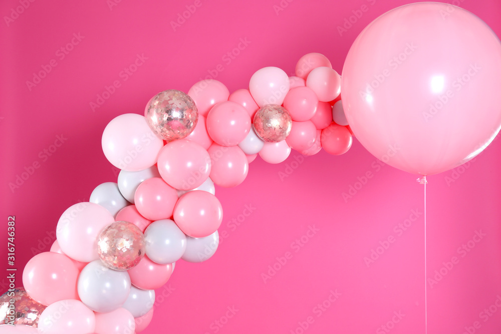 Beautiful composition with balloons on pink background
